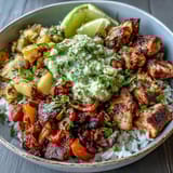 Vibrant sheet pan chicken tinga bowl with smoky chipotle-spiced chicken, roasted bell peppers, and zesty avocado salsa over fluffy rice. Easy weeknight dinner with bold Mexican flavors.