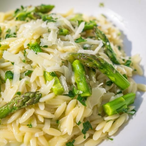 Springtime Asparagus Lemon Orzo Salad features crisp asparagus, toasted pine nuts, and a zesty lemon-olive oil vinaigrette over pasta.