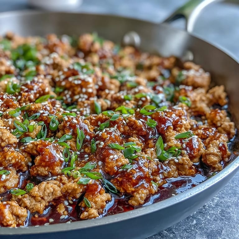 Hearty bowl of Korean-Style Ground Turkey mixed with green onions and sesame seeds, perfect for a quick and flavorful weeknight dinner.